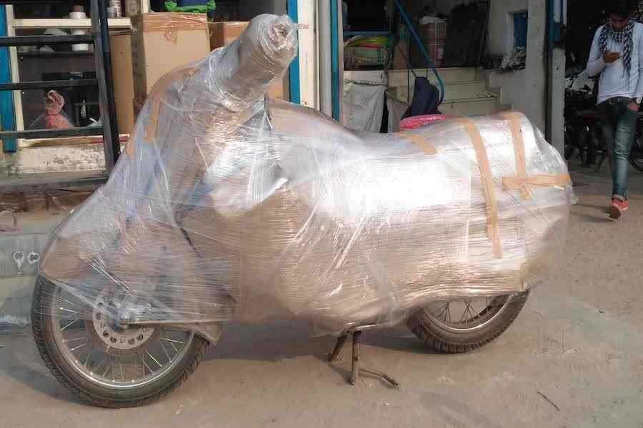 Two-wheeler wrapped securely before bike transportation service